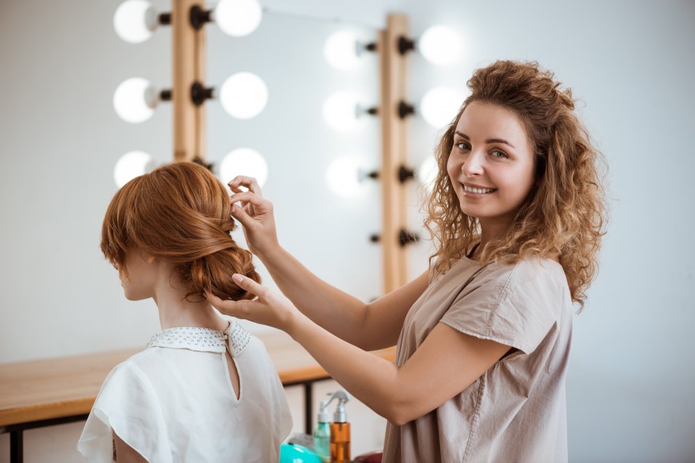 female-hairdresser-smiling-making-hairstyle-redhead-woman-beauty-salon